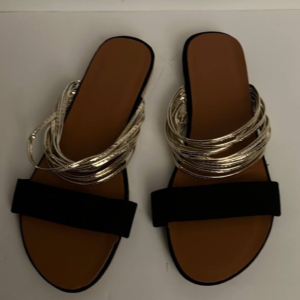 New sandals with fun black and gold straps. NWOT. Size 11.